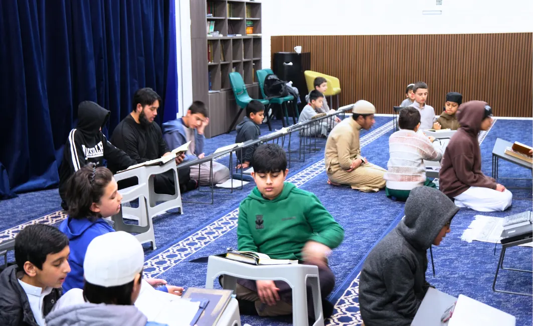Students of different ages studying in the classroom