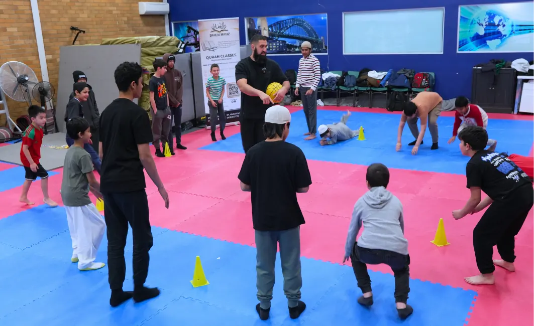 Students playing supervised games in the sports hall